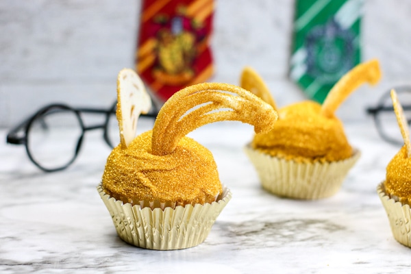 Making Golden snitch cupcakes for Harry Potter party!