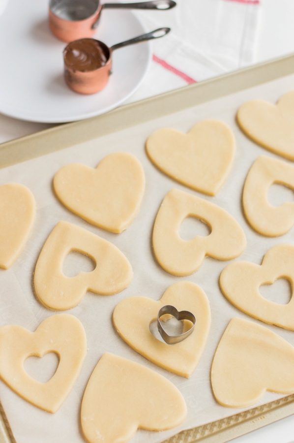 cutting hearts out of sweetheart cookies